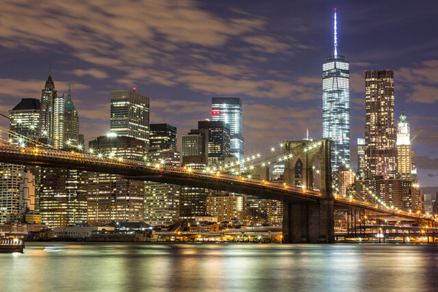 Brooklyn Bridge and Downtown Skyscrapers in New York at Night
