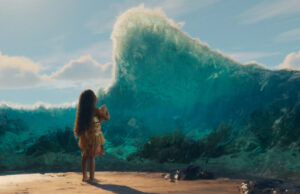 Oceania da oggi in sala: il divario di 57 punti tra critici e pubblico USA Vaiana bambina osserva un'onda gigante dell'oceano in una scena del film Oceania, al cinema dal 19 agosto 2026